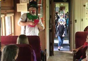 Rosco the magic clown on the train