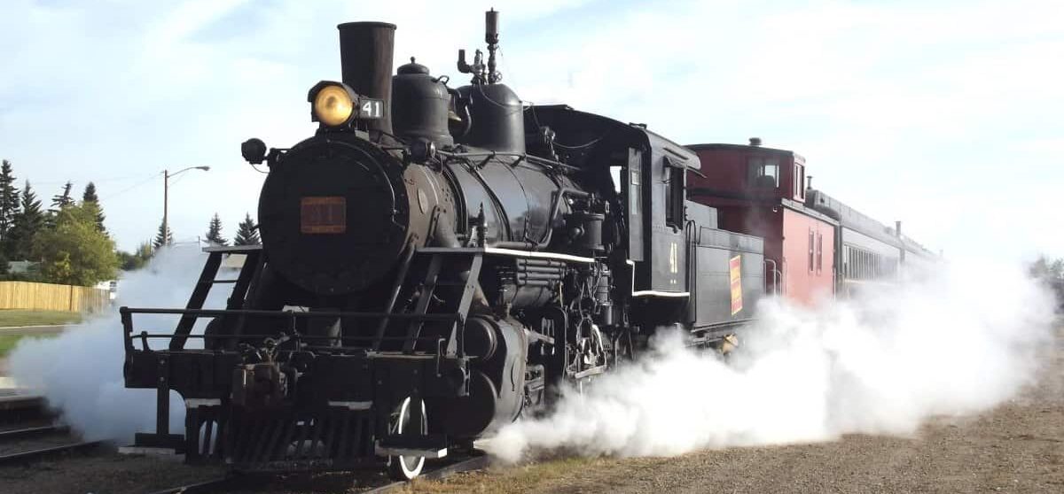 Steam train surrounded by white steam