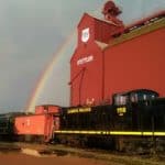 Alberta Prairie Railway train with double rainbows