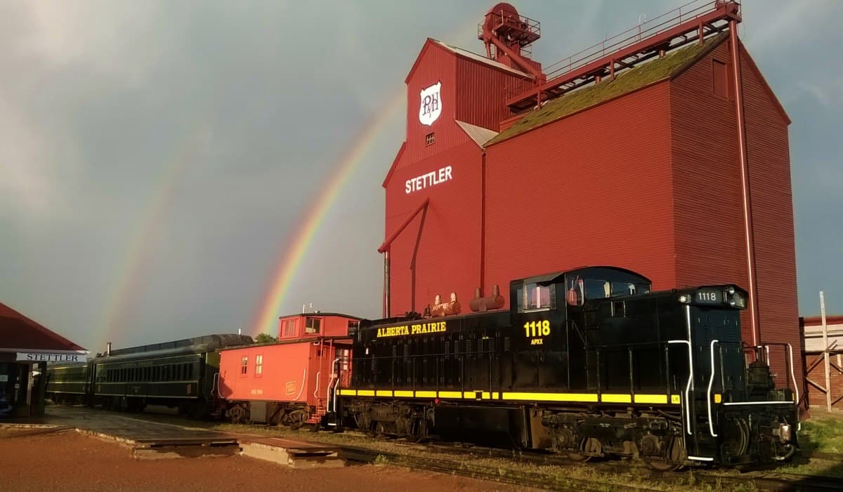 Alberta Prairie Railway train with double rainbows