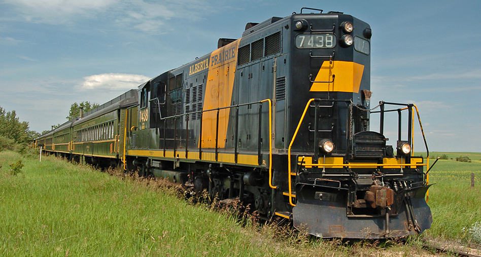 GP9 Locomotive No. 7438 makes its way through the country side.